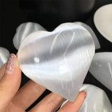 Heart shaped selenite palm stone