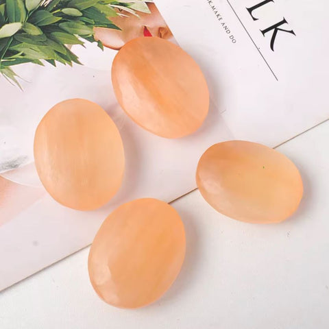 Orange selenite palm stone
