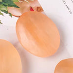 Tumbled orange selenite stone