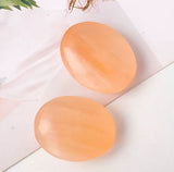 Tumbled orange selenite stone