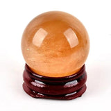 Orange selenite sphere with stand