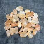 Orange selenite tumbled stone