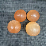 Orange selenite sphere