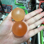 Orange selenite sphere