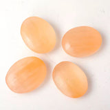 Red selenite palm stone