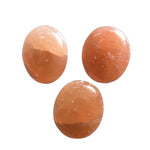 Orange selenite palm stone