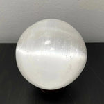 Selenite sphere with holder