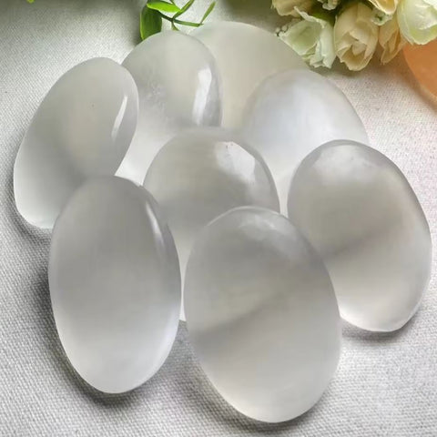 Oval shape selenite palm stone