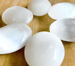 Egg shape selenite palm stone