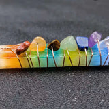 A close up view of the gemstones that is attached with copper wire.