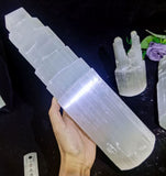 Someone holding an extra large monolith tower, made of solid raw crystalline.