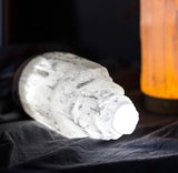 Image of the lamp on side lit up. 