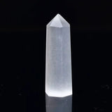A close up view of a translucent obelisk small in size.