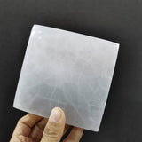 Wide polished top of the medium square satin spar plate.